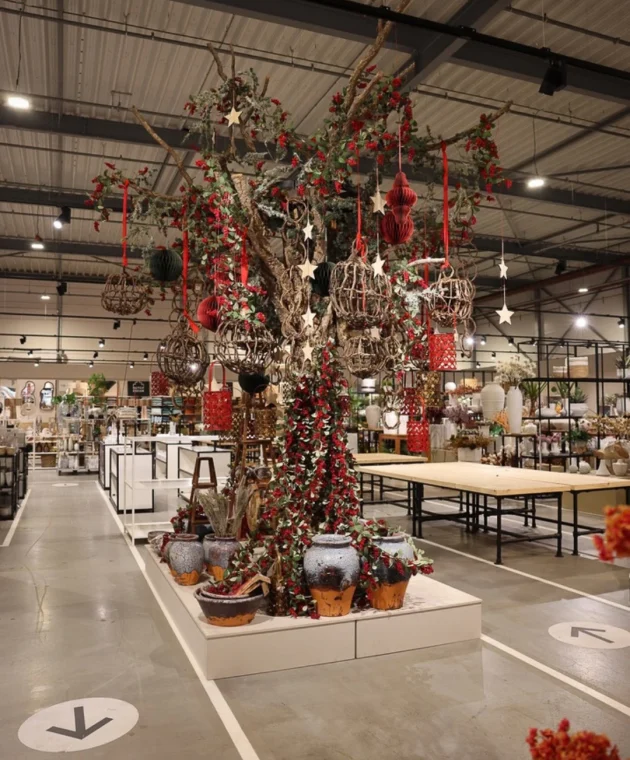 tree decorated with red accessories for the autumn and Christmas seasons at TICA